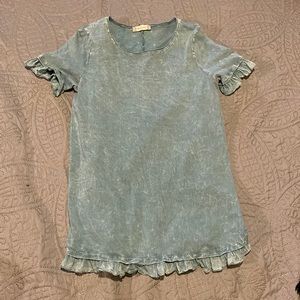 Light blue “acid-washed” shirt.